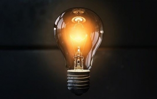 Electric light bulb on dark background